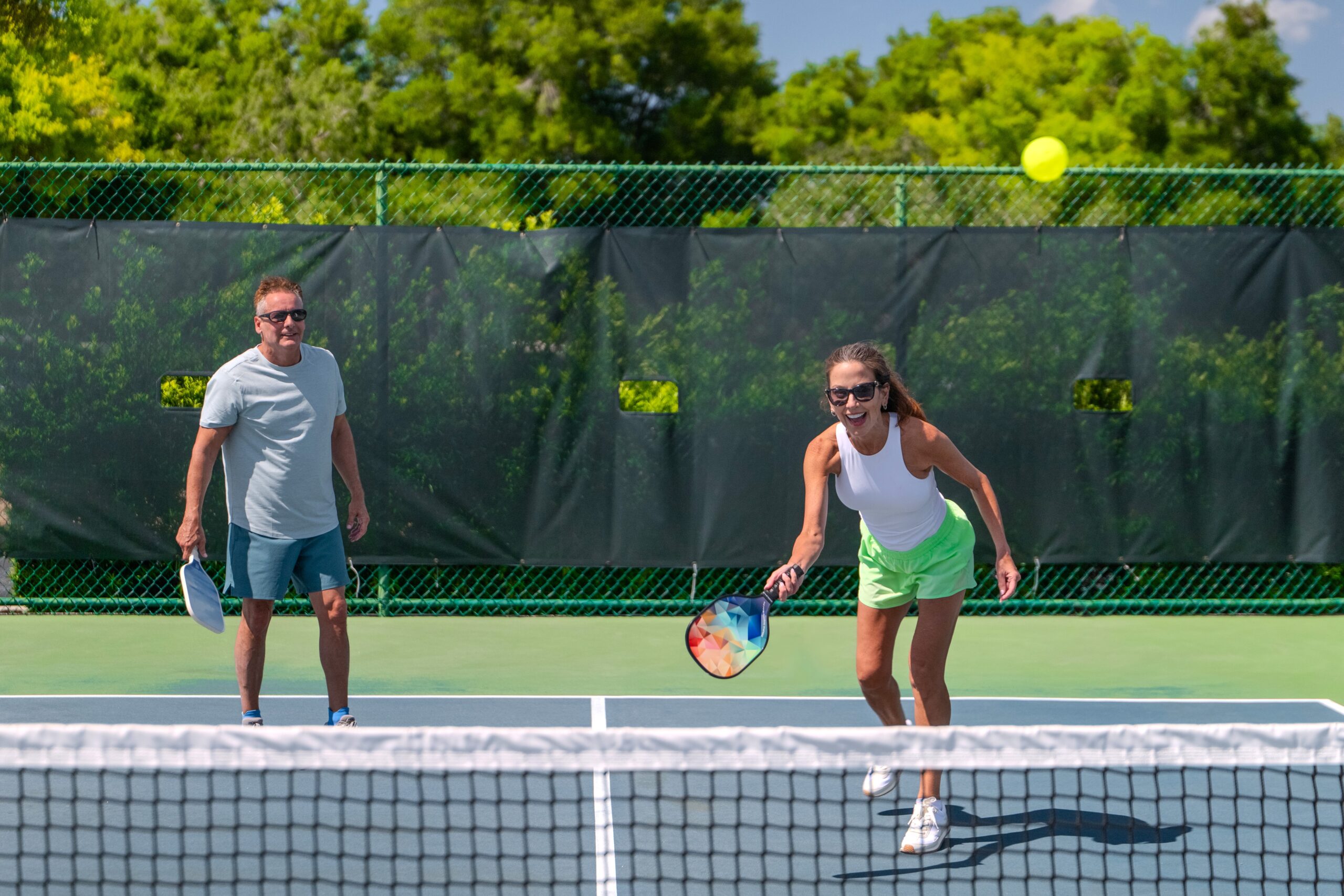 Happy couple enjoying pickleball at Citrus Hills Florida retirement community
