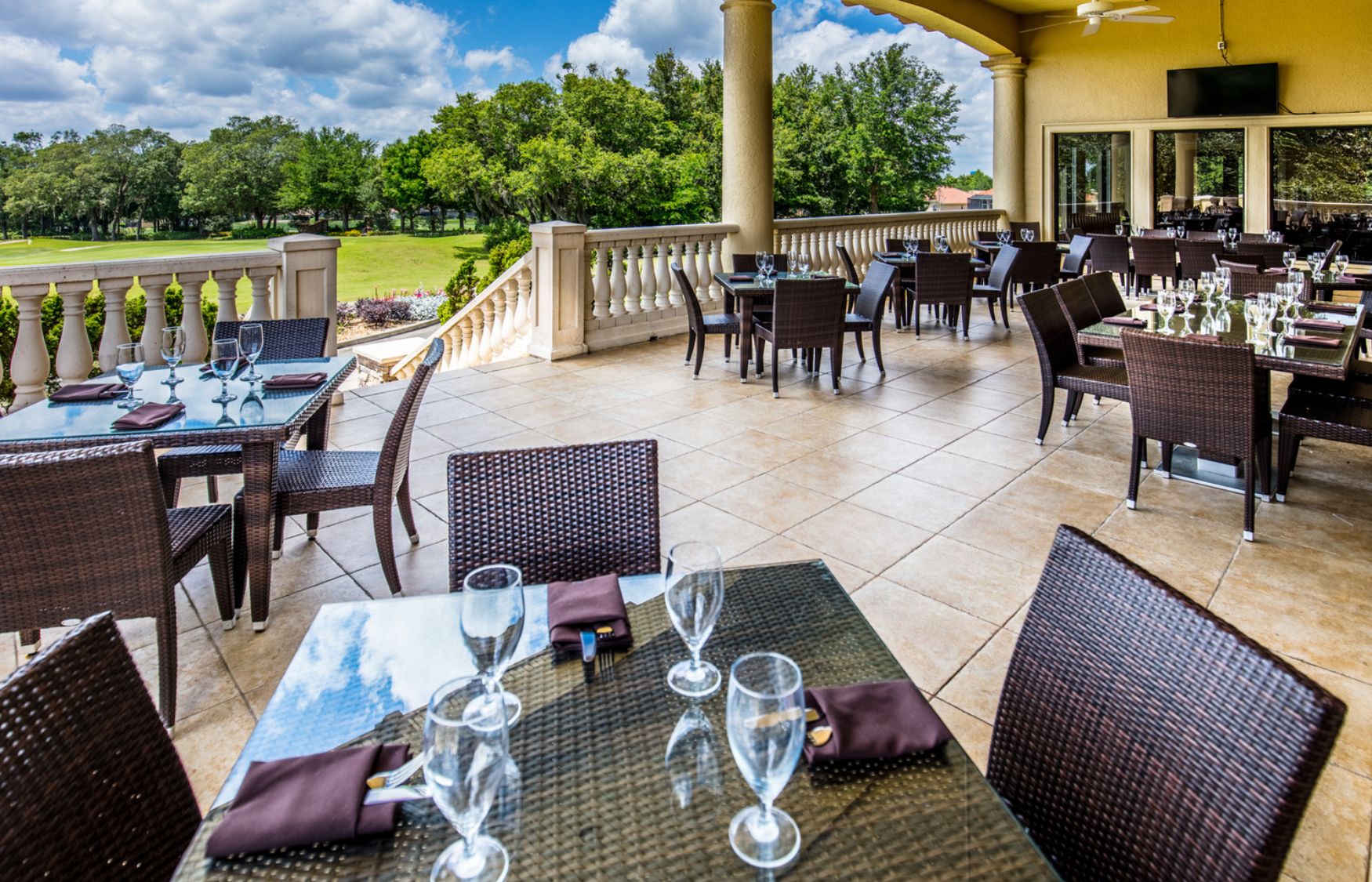 Outdoor dining on the lanai at Skyview Restaurant in Florida retirement community